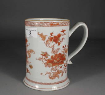 An eighteenth century Chinese tankard of cylindrical: An eighteenth century Chinese tankard of cylindrical form with spreading base and grooved scrolling handle, enamelled in iron red and gilded with peonies under a trellis bands, 6.25''.