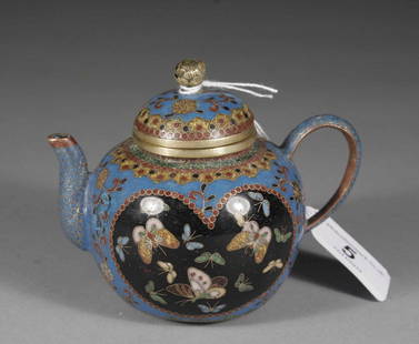 A small Chinese blue ground cloisonne tea pot and co: A small Chinese blue ground cloisonne tea pot and cover with peony bud finial and decorated with butterflies.