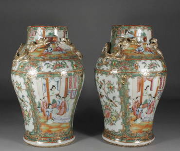 A pair of nineteenth century Cantonese baluster vase: A pair of nineteenth century Cantonese baluster vases with applied moulded dragons to the shoulders, decorated in gilt and enamelled with stylized borders containing panels of flowers and figures,