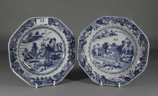 A pair of eighteenth century Chinese octagonal dish: A pair of eighteenth century Chinese octagonal dishes, painted in underglaze blue with lambrequin borders framing typical landscapes, 8.75''.