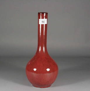 A Chinese bottle vase, decorated in sang de boeuf g: A Chinese bottle vase, decorated in sang de boeuf glaze, 12.5''.