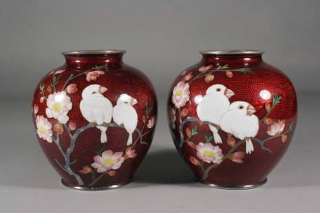 A pair of Japanese Meiji period cloisonne vases of: A pair of Japanese Meiji period cloisonne vases of compressed globular form, red ground and decorated with birds in branches, 4.75''.