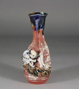 A Japanese Sumedho bottle vase, red ground and ador: A Japanese Sumedho bottle vase, red ground and adorned with a figure, signed tablet verso, 7''.