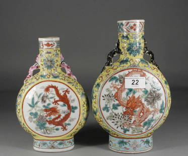 Two similar nineteenth century Chinese moon flasks,: Two similar nineteenth century Chinese moon flasks, yellow ground and each enamelled with two panels containing dragons, largest 10''.