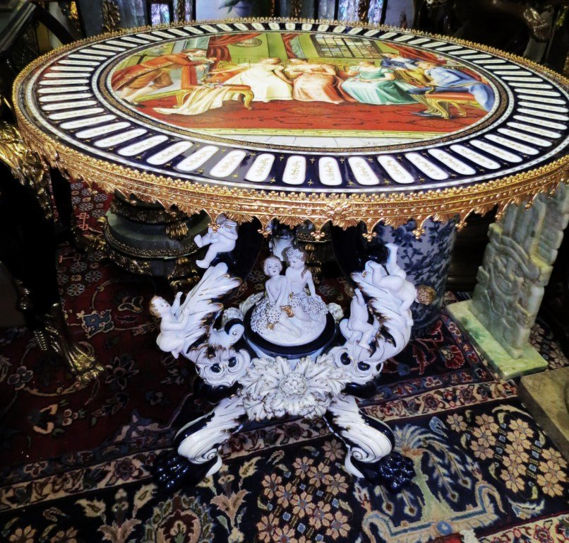 Porcelain and Dore Bronze Hall Table: with cherubs and romantic scene. Signed, Zonlua. 32"H - 32"Dia. --- Est. shipping = $280