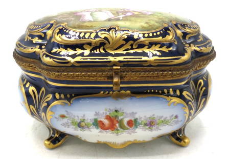 Sevres Porcelain Jewelry Box w/ Romantic Scene H: 4" W: 8" x D: 4": France - Shipping In - House available - The Manufacture nationale de Sevres is one of the principal European porcelain manufactories. It is located in Sevres, Hauts-de-Seine, France. It is the contin