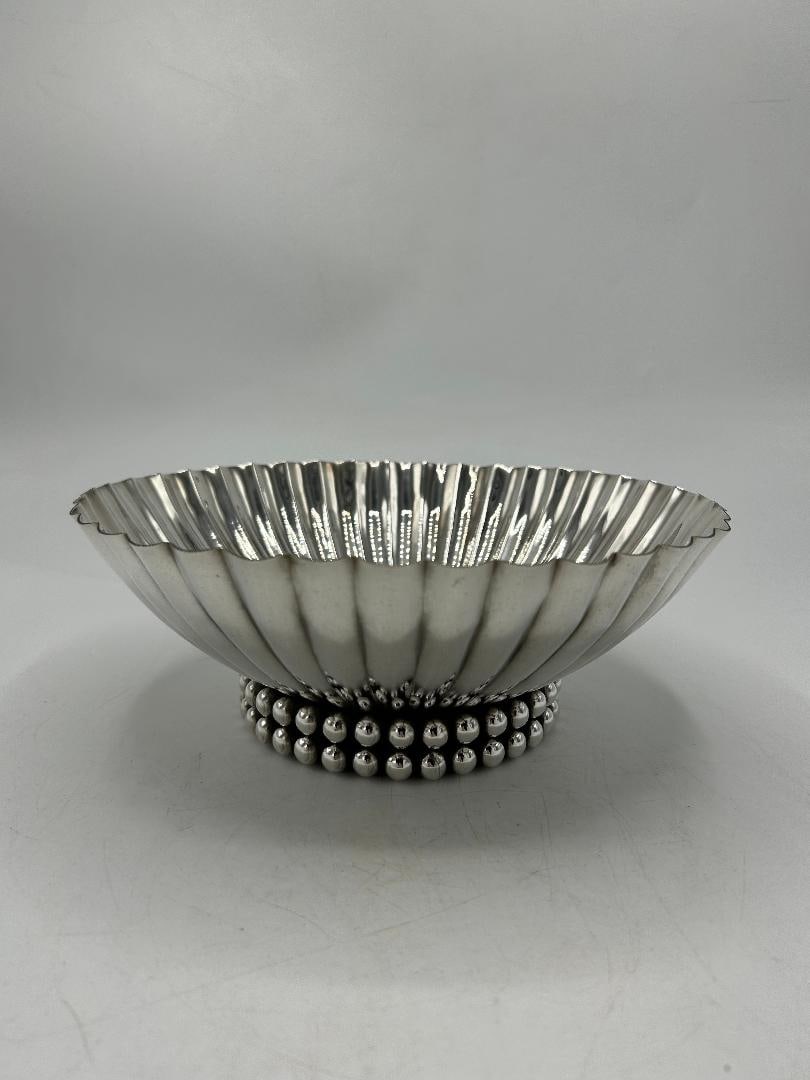 Jean Despres Art Deco Silverplated Centerpiece H: 3.5" Diam: 9" France: Shipping in - House available. Jean Despres was a French jewelry maker and designer best known for his intricate Art Deco jewelry made from semi-precious stones, machine parts, and enamel. Despres' ae