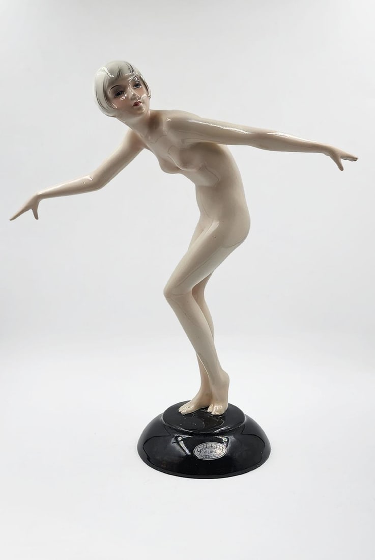 Goldscheider Porcelain Figure by Josef Lorenzl H: 11" W: 9" D: 4" Austria: Shipping in - House available. In 1885, Friedrich Goldscheider came from the Bohemian city of Pilsen to Vienna and founded the Goldscheider Porcelain Manufactory and Majolica Factory. It became one of