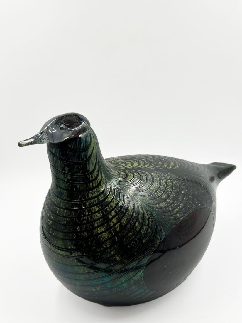 Oiva Toikka Glass Figure of Bird H: 7" W: 9.5" D: 5.2" Finland: Shipping in - House available. Oiva Toikka was born in Viipurin maalaiskunta, the rural municipality surrounding then-Finnish Vyborg, now part of Russia. He grew up in a farm and was influenced by the