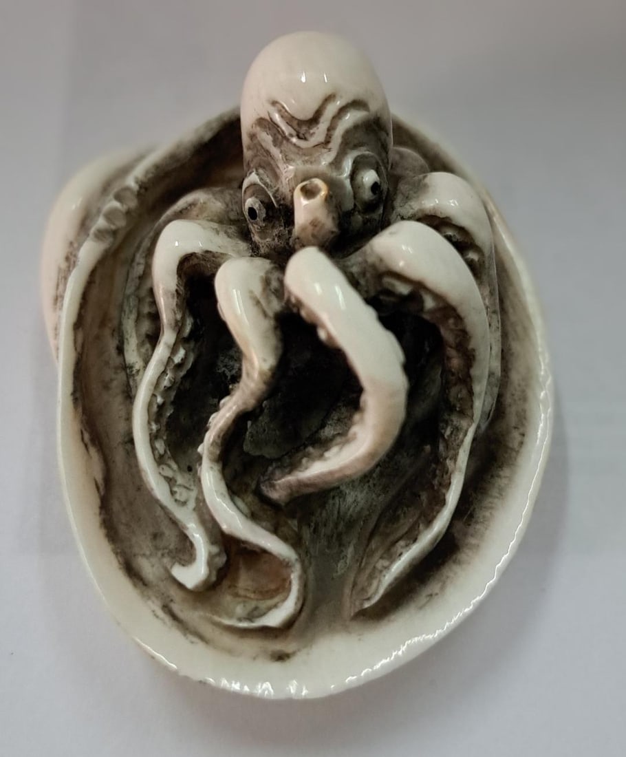 Antique Hand Carved "Bone" Netsuke H: 2.8" Excellent Condition: Shipping in - House available. No International shipping for this item. A netsuke is a miniature sculpture, originating in 17th century Japan. Initially a simply-carved button fastener on the cords of