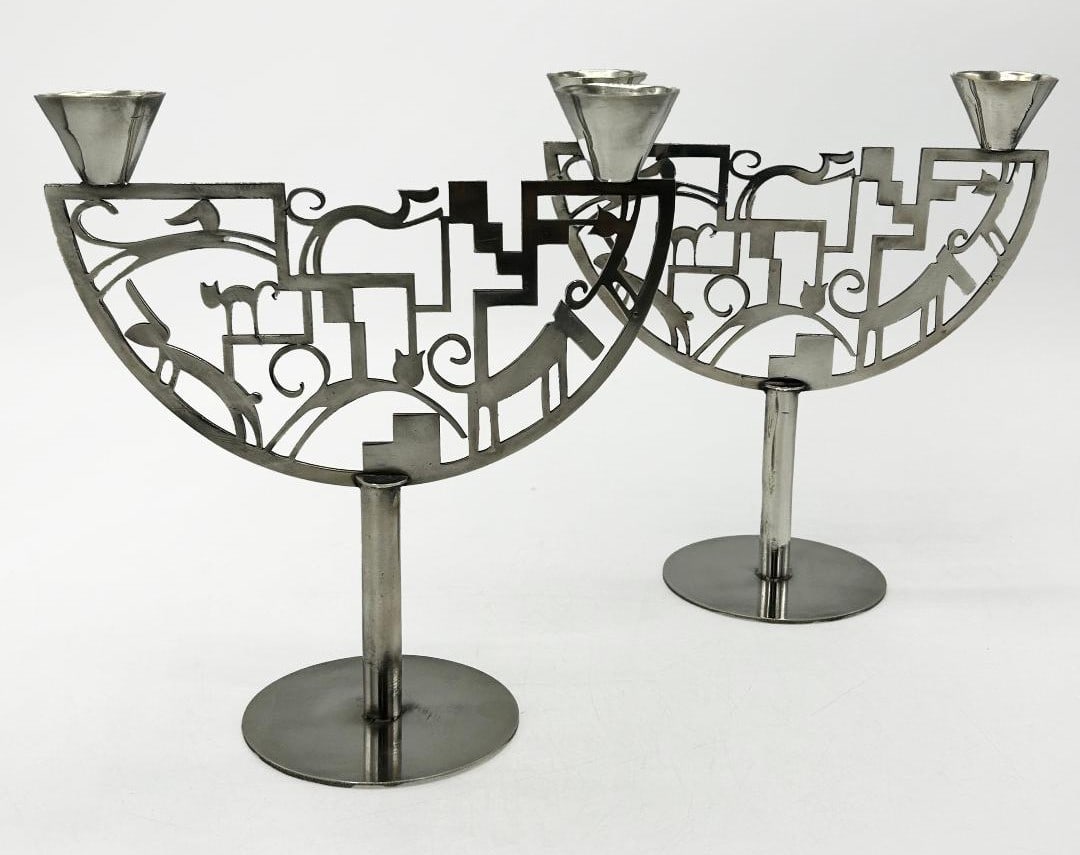 Atelier Hagenauer Art Deco Silverplated Pair of Candelabras H: 8" W: 7" D: 4": Shipping in - House available. Carl Hagenauer (1872 - 1928) founded what became the Werkstatte Hagenauer Wien in 1898. He began as an apprentice at Wurbel & Czokally, a silverware producer in Vienna.