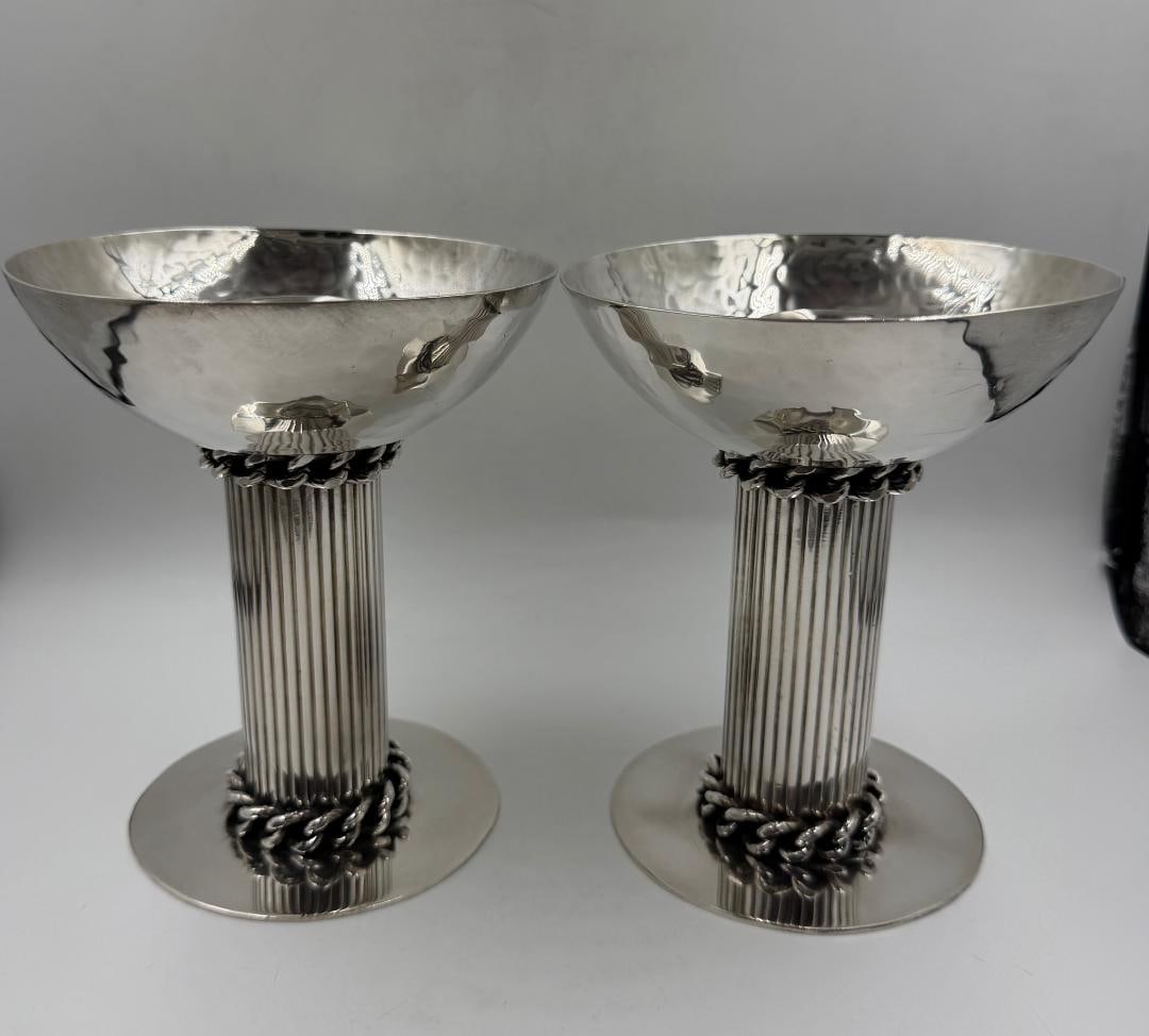 Jean Despres Art Deco Silverplated Pair of Candlesticks H: 6" France: Shipping in - House available. Jean Despres was a French jewelry maker and designer best known for his intricate Art Deco jewelry made from semi-precious stones, machine parts, and enamel. Despres' ae