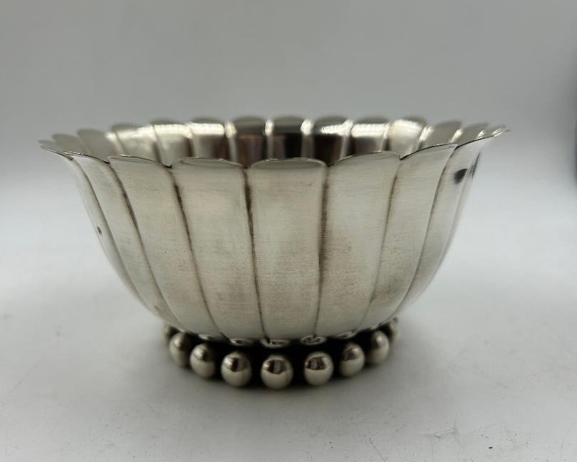 Jean Despres Silverplated Art Deco Centerpiece H: 3" Diam: 5.6" France: Shipping in - House available Jean Despres was a French jewelry maker and designer best known for his intricate Art Deco jewelry made from semi-precious stones, machine parts, and enamel. Despres' aes
