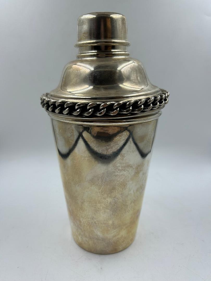 Jean Despres Silverplated Art Deco Cocktail Shaker H: 7.5" D: 3.5" France: Shipping in - House available Jean Despres was a French jewelry maker and designer best known for his intricate Art Deco jewelry made from semi-precious stones, machine parts, and enamel. Despres' aes