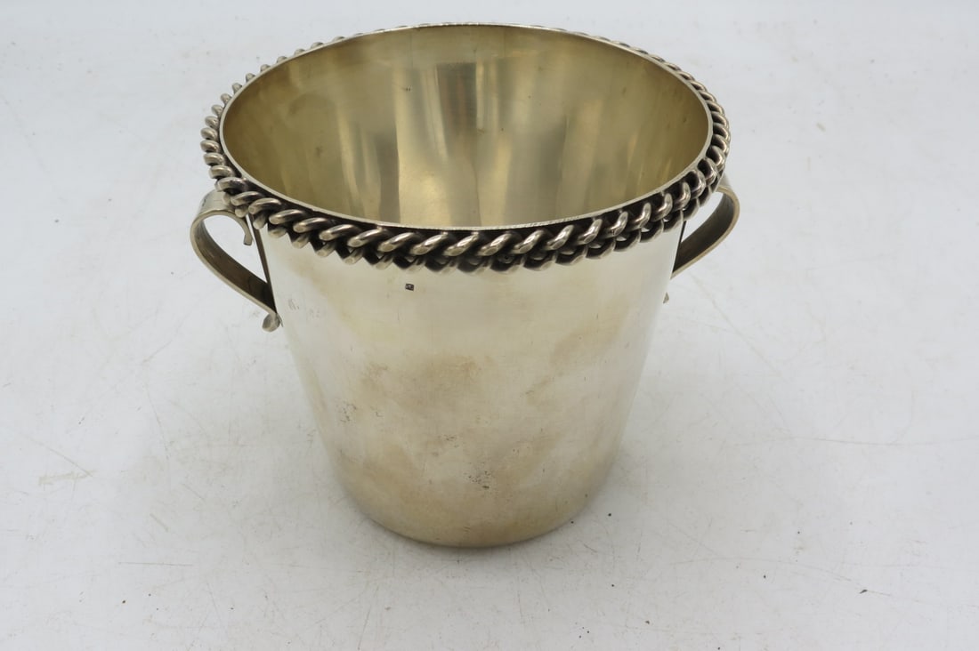 Jean Despres Art Deco Silverplated Ice Bucket H: 5" W: 6.7" France: Shipping in - House available. Jean Despres was a French jewelry maker and designer best known for his intricate Art Deco jewelry made from semi-precious stones, machine parts, and enamel. Despres' ae