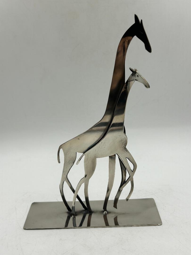 Atelier Hagenauer Art Deco Silverplated Figure of Giraffes) H: 7.5" W: 5" D: 2": Shipping in - House available. Carl Hagenauer (1872 - 1928) founded what became the Werkstatte Hagenauer Wien in 1898. He began as an apprentice at Wurbel & Czokally, a silverware producer in Vienna. 