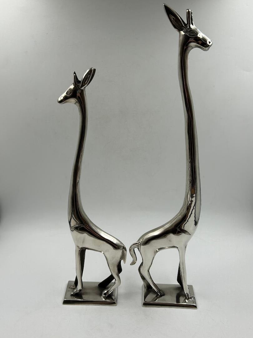 Atelier Hagenauer Pair of Art Deco Figures of Giraffes: Shipping In - House available. Carl Hagenauer (1872 - 1928) founded what became the Werkstatte Hagenauer Wien in 1898. He began as an apprentice at Wurbel & Czokally, a silverware producer in Vienna. 