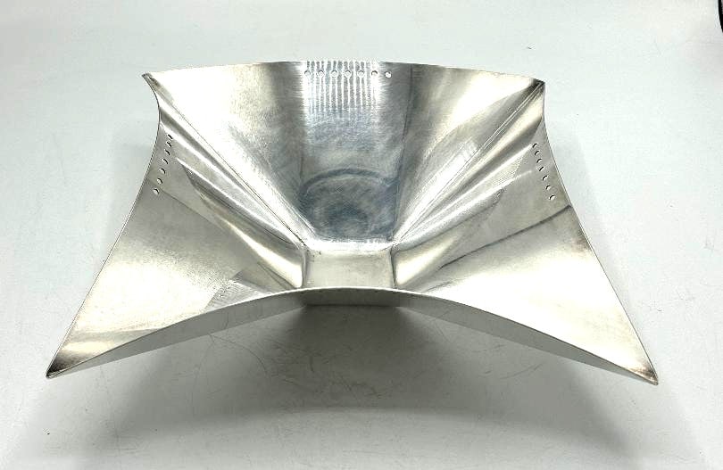 Lino Sabatini Art Deco Centerpiece H: 4" W: 12" D: 10" Italy: Shipping in - House available. Lino Sabattini is an Italian designer best known for his innovative design of silver-plated candle holders, vases, kettles, and other household wares. Working in the sam