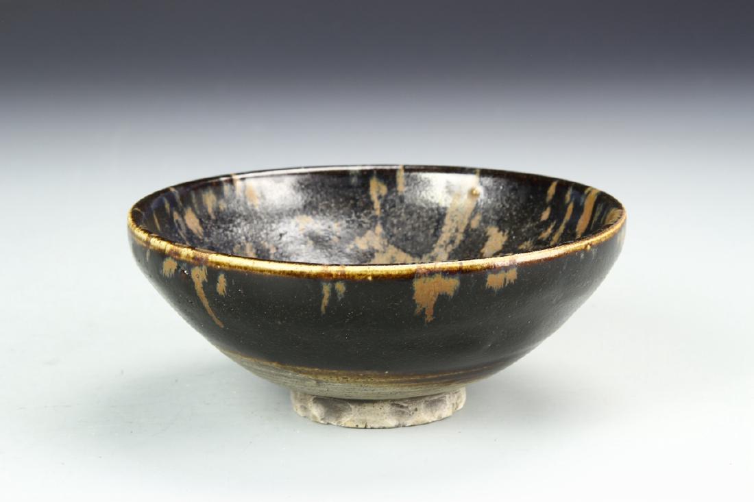 Chinese Antique Jian Yao Bowl: China, antique Jian Yao bowl, wide mouth, deep potted dish, high sides tapering to footed base, deep brown glaze with lighter splashes throughout. Height 2 1/4 in., Width 5 3/4 in.