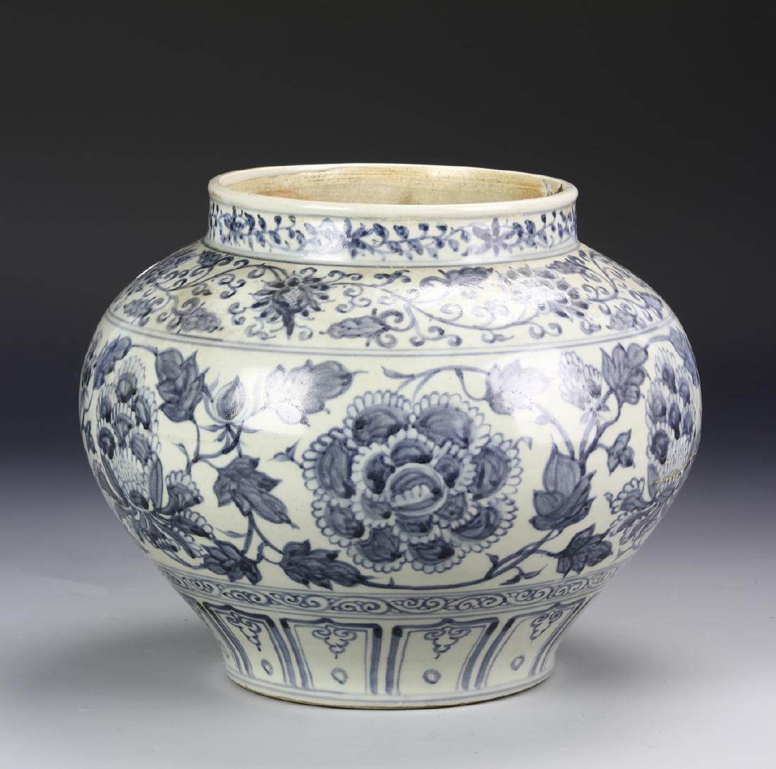 Chinese Blue And White Jar: China, blue and white jar, wide border at mouth, rounded shoulders with bulbous body on flat base, interlocking floral designs in light blue hues. Height 8 1/2 in.