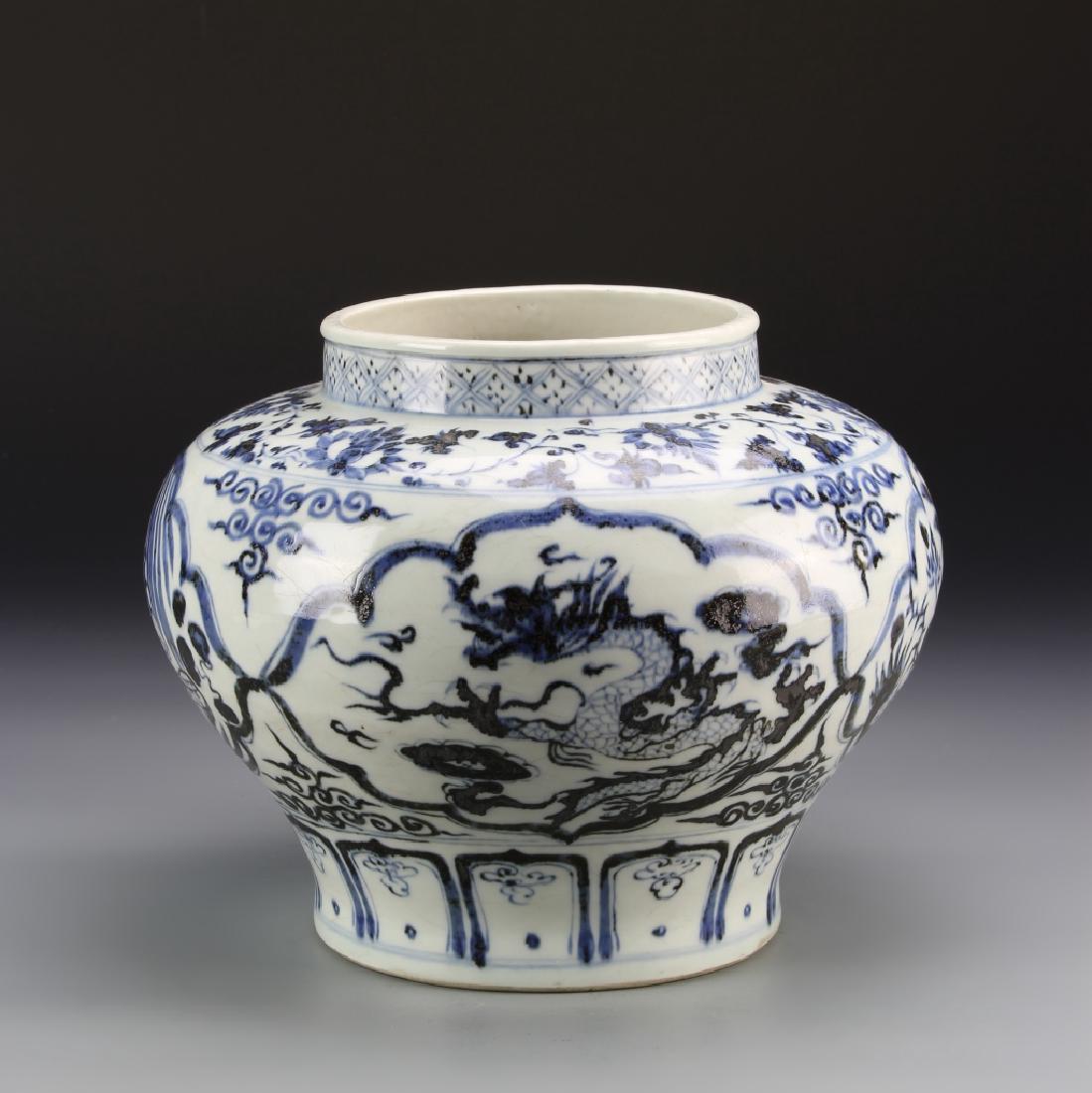 Chinese Blue and White Jar: China, antique blue and white jar with dragon and floral motifs, bulbous body, with straight rim, white ground, with blue painted designs and three clawed dragon motif. Height 8 1/4 in.