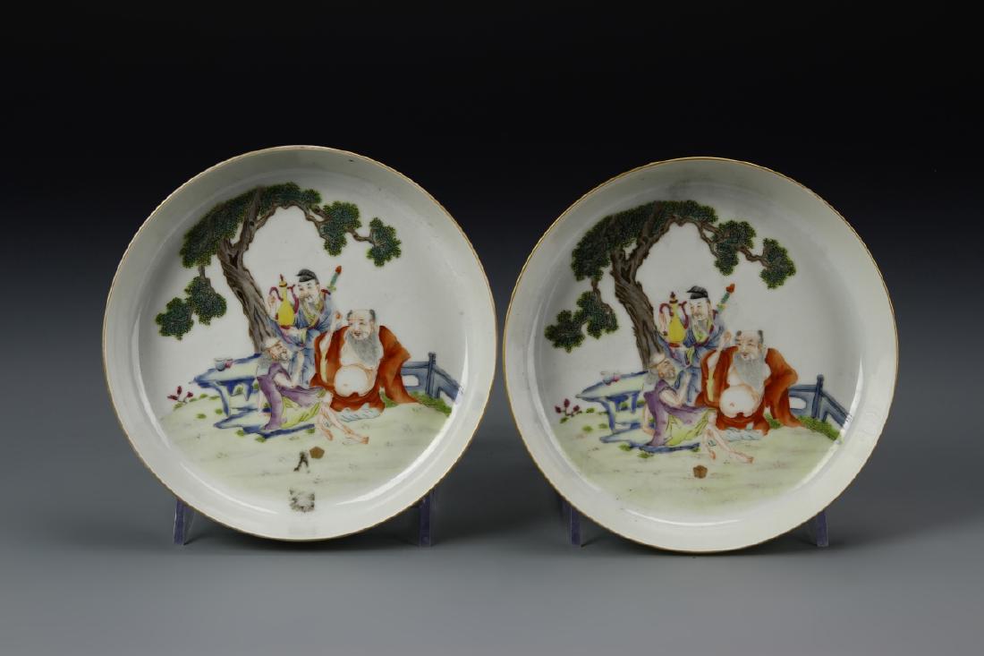 Pair of Chinese Famille Rose Plates: China, 19th C., a pair of Famille Rose plates, with central decoration of three wise men drinking from a tall wine pot underneath a tree, Yong Zhong mark on base. Diameter 5 3/4 in.