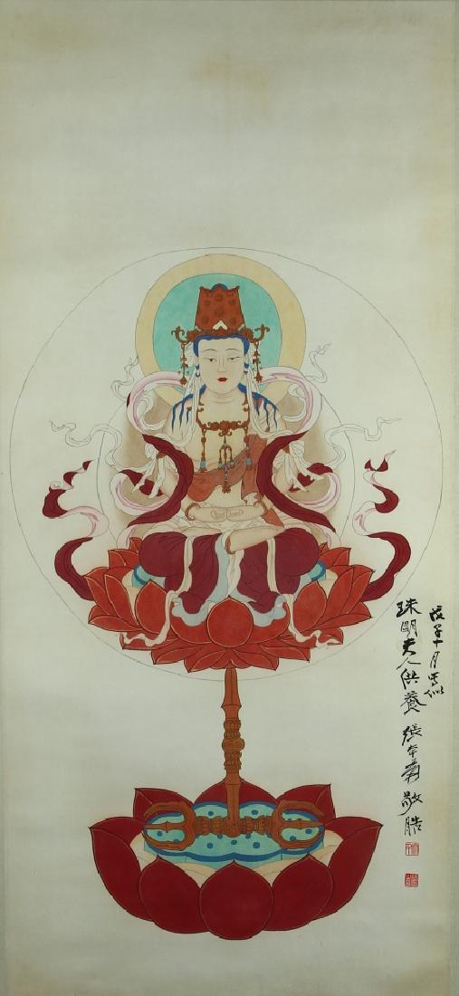 Chinese Scroll Painting of Buddha: China, scroll painting of Buddha, colored ink on paper, simplistic painting of seated Buddha wearing bright red clothing, surrounded by ribbons and on lotus blossom base, signed Zhang Dagian. Width 19