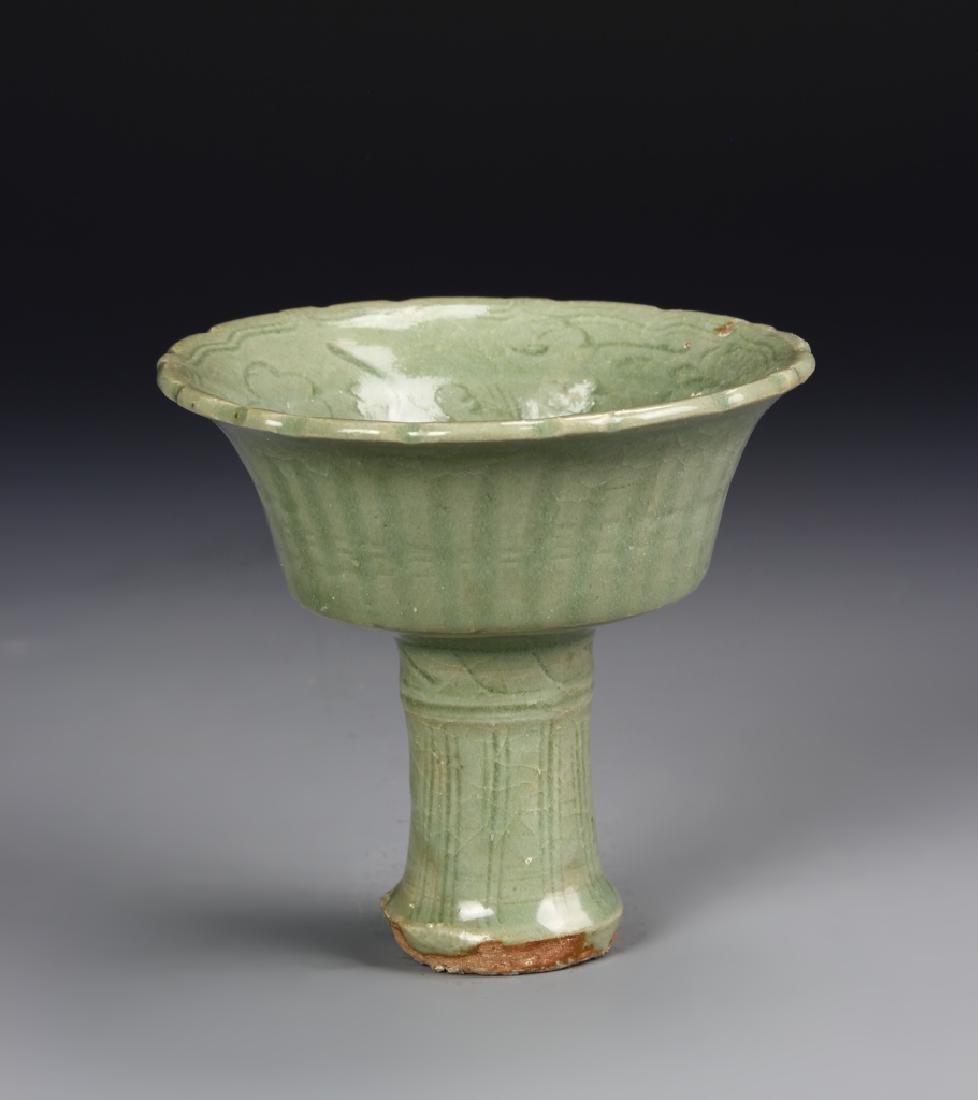 Chinese Lungquan Yao High Stem Bowl: China, Ming Dynasty, Lungquan Yao High Stem Bowl, flared rim at mouth, incised decoration throughout in pale green glaze, high shine finish and unglazed base. Height 4 3/4 in.