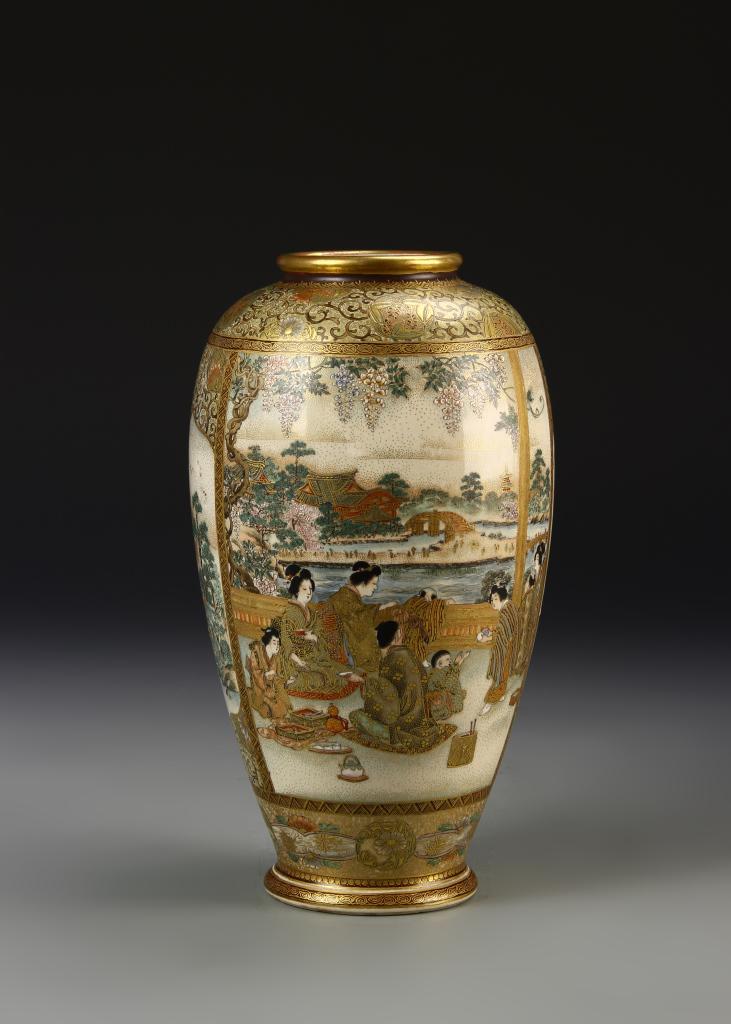 Japanese Satsuma Vase: Japan, 19th C., Meiji Period, Satsuma vase, gilt rimmed mouth, with dense, gilt decoration throughout in panels and scrolls, with scenes depicting ladies in a garden landscape, mark on base. Height 10