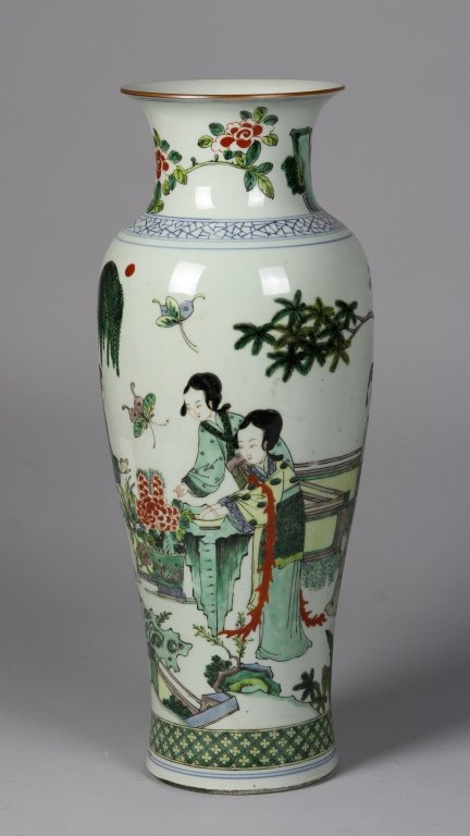 Chinese Wucai Vase: China, late 19th C., Wucai vase, decorated with lady figures under trees in a court yard with butterflies flying over. Height 21 in.; Width 8 in.