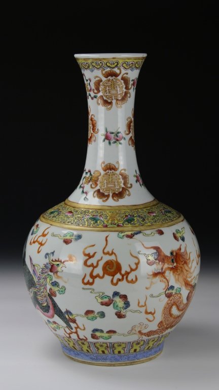 Chinese Famille Rose Vase: China, late 19th C., famille rose vase, decorated with floral, bat and dragon motifs, six character Guangxu mark and of period. Height 16 1/4 in.; Width 9 1/2 in.
