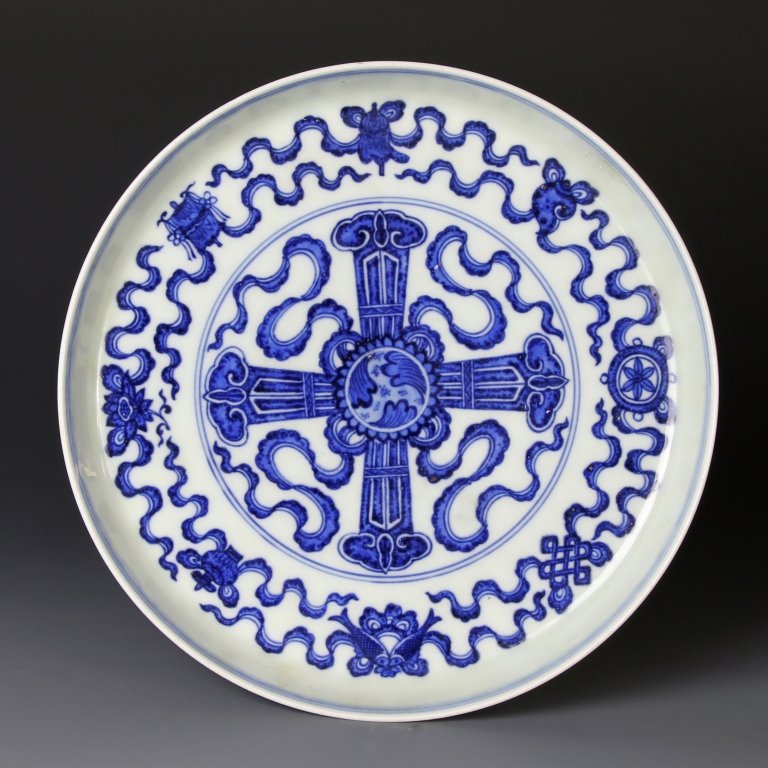 Chinese Blue and White Stem Plate: China, 19th C., blue and white stem plate, decorated with Buddhist eight elms and auspicious symbols, back painted with a band of floral motifs, Qianlong mark on base. Diameter 7 3/4 in. Provenance: A