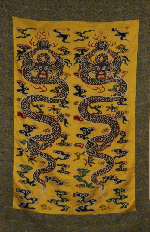Chinese Silk Embroidery Panel: China, Qing Dynasty(1644-1911), silk embroidery panel of two dragons holding fire balls amid clouds and fire. Length 40 in.; Width 27 in.