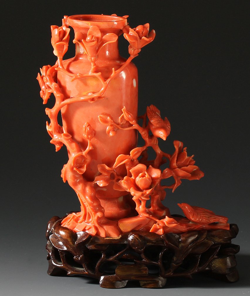Chinese Carved Coral Mini Vase: China, late 19th C., intricately carved coral mini vase with carved plum flowers and branches, with carved wood base. Height 3 3/4 in.