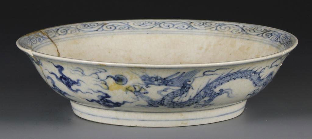 Chinese Ming Blue and White Plate: Ming Blue and White Plate, China. Center illustration depicts two dragons and the rim has a swilling pattern design. Marking on base. (h. 1 1/2 in.; w. 6 in.)