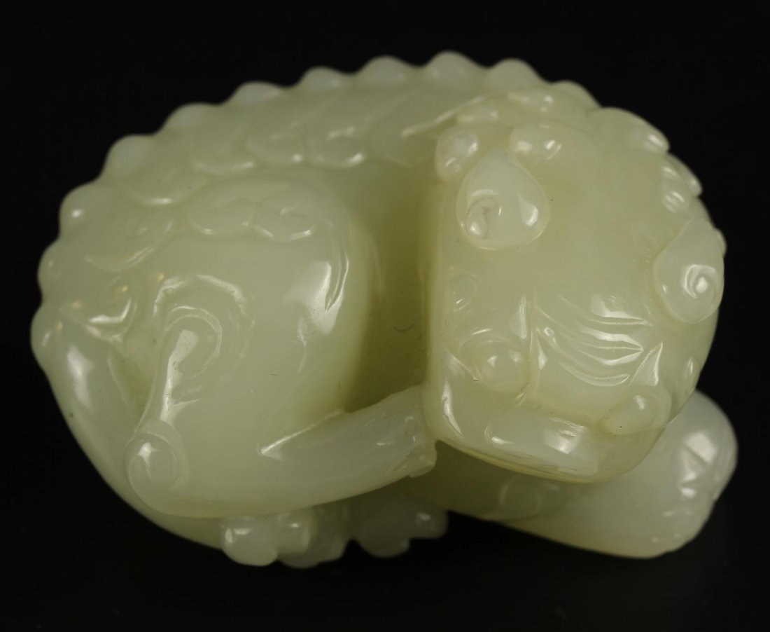 Chinese Jade Foo Dog: China, Late 19th C., a detailed carved jade foo dog. Height 2 1/4 in.