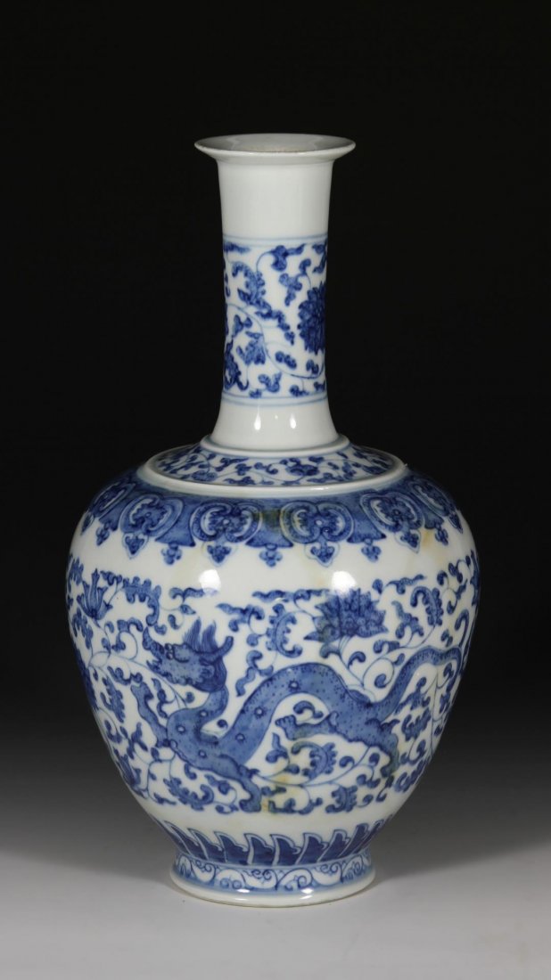 Chinese Blue and White Vase: China, 18th-19th C., blue and white vase, decorated with dragon and floral paintings, Qianlong mark on base and possible period. Height 10 1/4 in.; Width 5 1/8 in. Provenance: A private collection fro