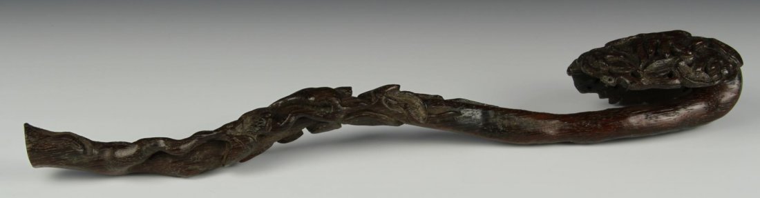 Chinese Carved Wood Ruyi Scepter: China, 19th C., intricately carved wood Ruyi scepter. Length 15 in.