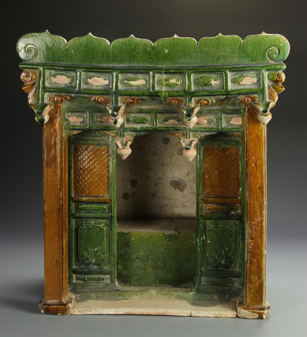 Chinese Ming Altar: China, Ming altar, carved in the form of an architectural structure with ornate lintel carvings, painted in green and brown. Height 19 in., Width 19 in.