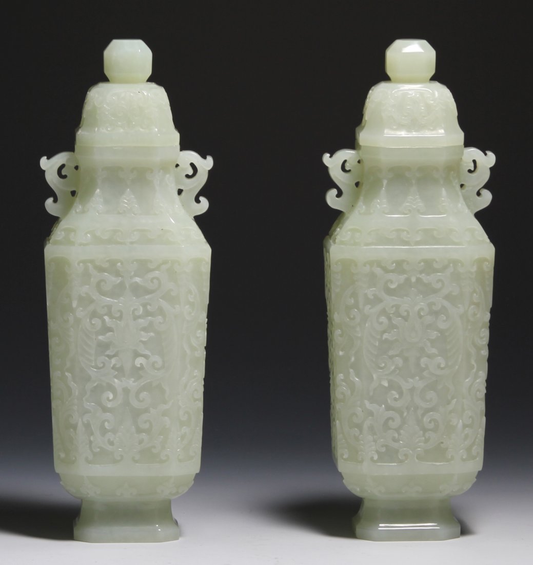 Pair of Chinese Jade Square Vases: China, 19th C., a pair of carved jade square vases, tall rectangular in form, overall bodies carved in relief with floral motifs, the necks are flanked with two chi dragon ears, with original box, top