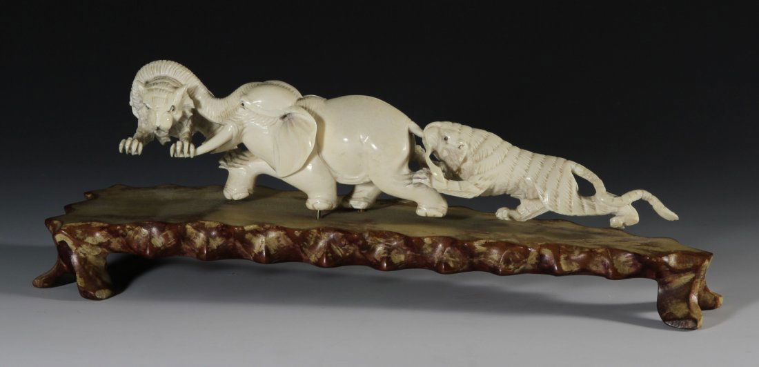 Chinese Carved Ivory Piece: China, 19th C.,carved ivory figurines of wild animals. Length 9 1/4 in., Height with stand, 3 1/2 in.