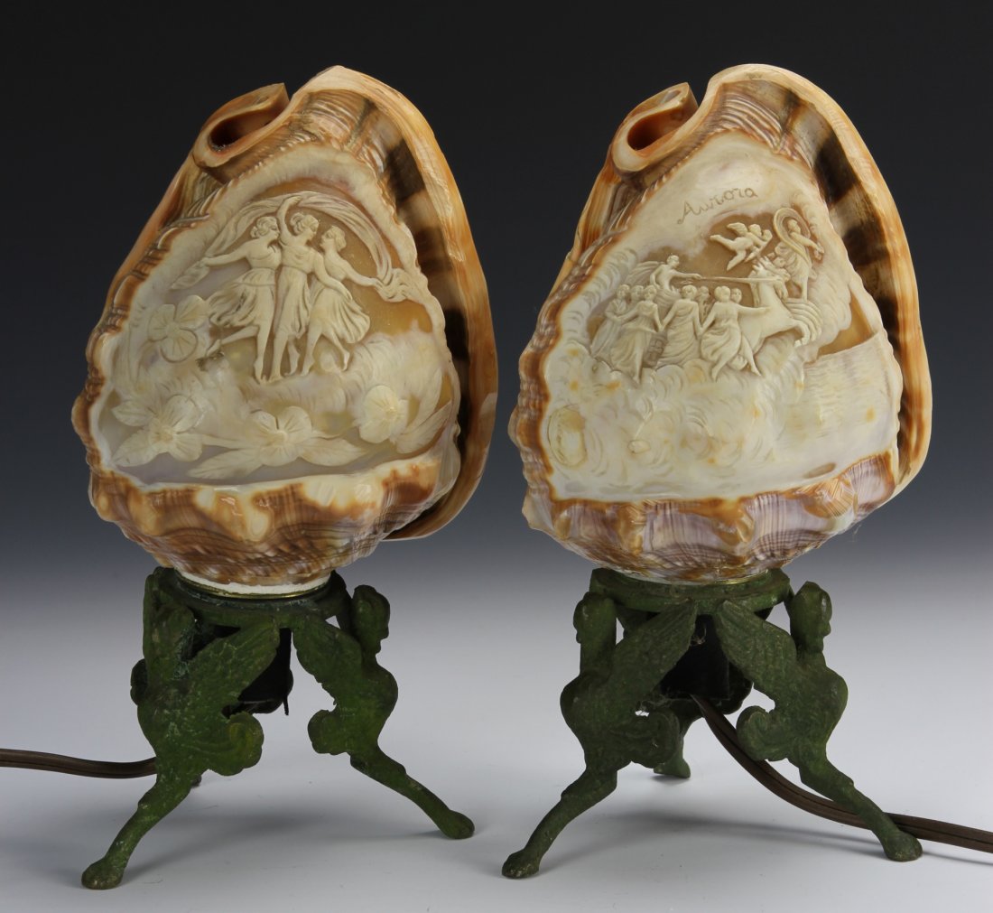 American Carved Shell and Bronze Lamps: America, pair of carved shell lamps with bronze stands, signed Awarocu. Height 8 1/4 in.