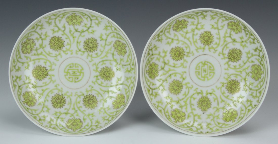 Pair of Chinese Famille Rose Plates: China, 19th C., a pair of Famille Rose plates, scrolling lotus flowers and auspicious symbols on the interior, bats on the exterior, Jian Qing mark. Diameter 6 in.