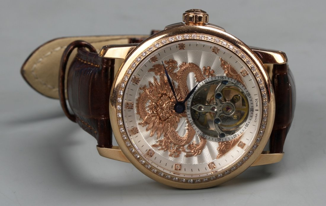 Chinese Rose Gold and Diamond Dragon Watch: China, rose gold and diamond watch featuring a dragon, Limited Edition 2011, Year of the Dragon. Diameter of face: 1 3/4 in.