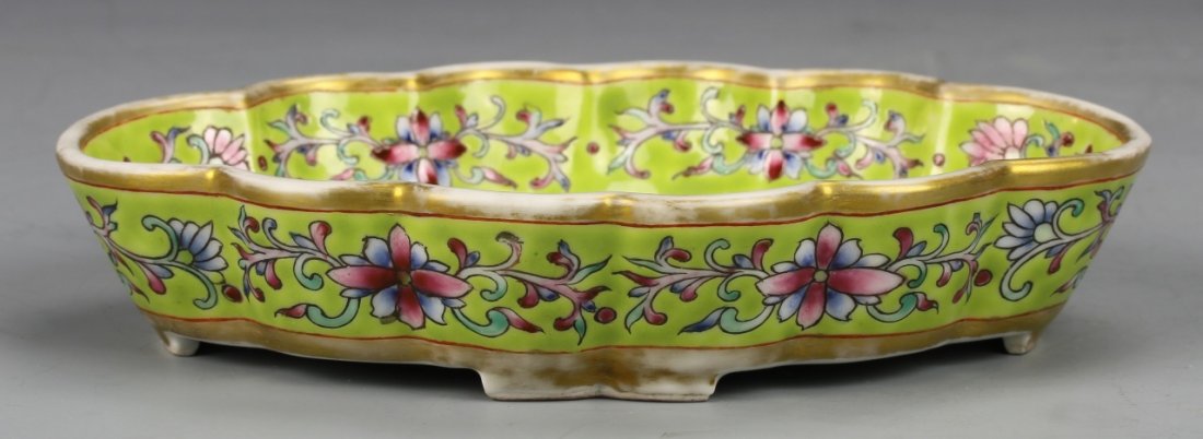 Chinese Antique Famille Rose Brush Washer: Chinese, Antique Famille Rose brush washer, decorated with attractive flower and scroll design, on a bright green ground, calligraphy characters and red seal in the center. Height 1 1/4 in., Length 6 