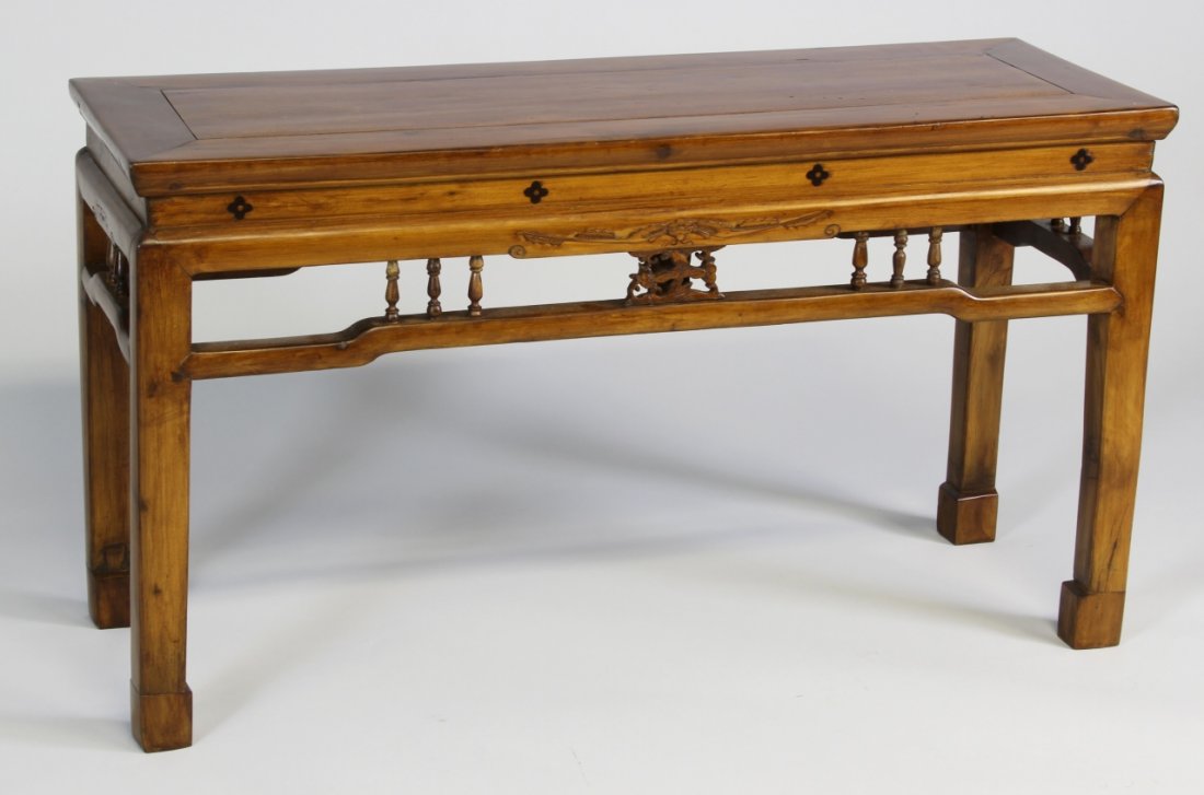 Chinese Huanghuali Table: China, 19th C., very rare Huanghuali low wooden table with carved elements. Width 37 in., Height 20 1/2 in., Depth 13 in.