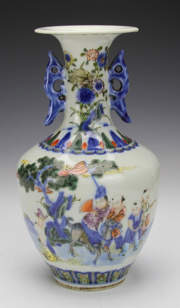 Chinese Famille Rose Vase: China, 19th C., Famille Rose vase, flared rim with blue decorative ears on neck, painted with colorful scenes of children traveling and playing with water, mark on base. Height 9 in.
