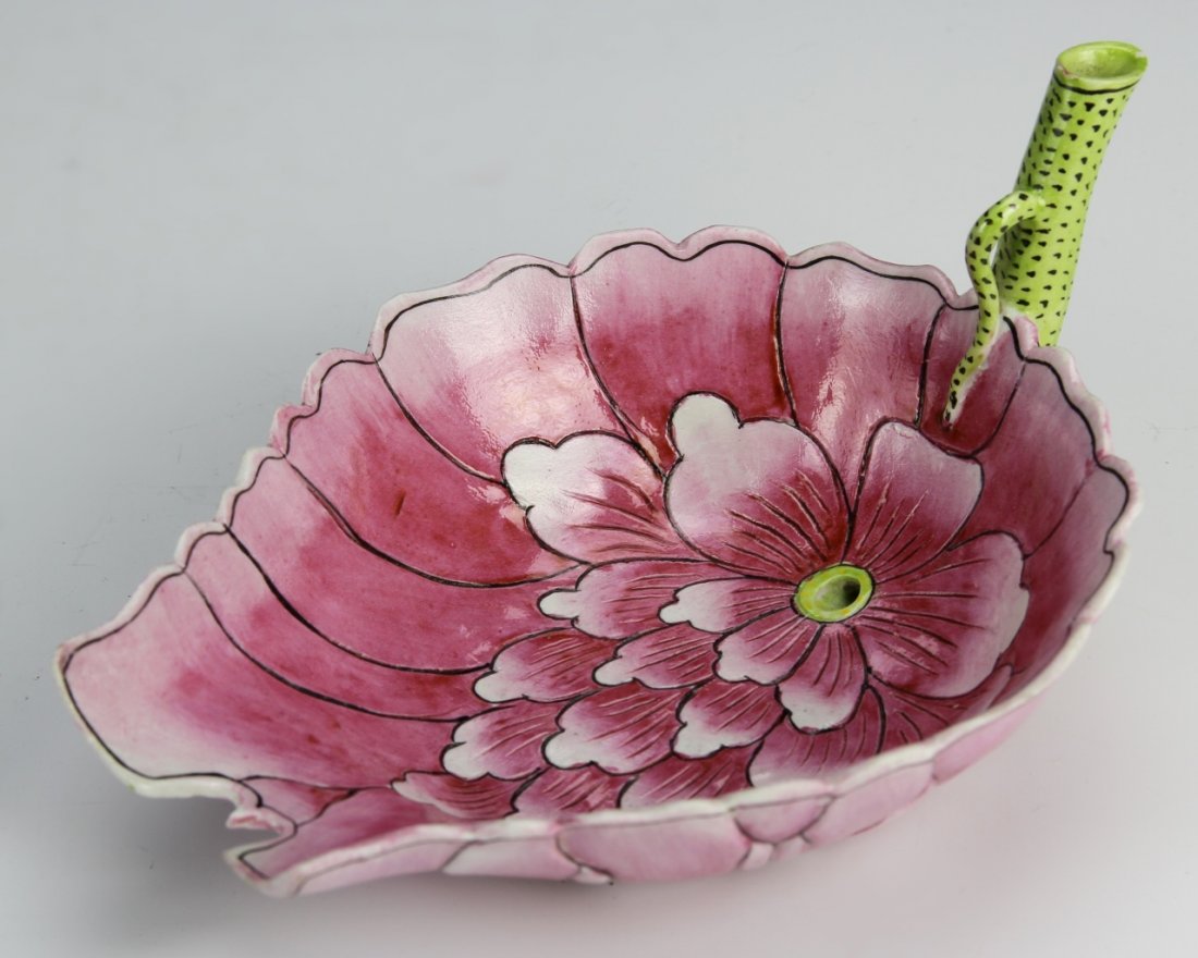 Chinese Enameled Wine Cup: China, 19th C., enameled wine cup, in pink shades and floral design, scallop edging, Guangxu mark on green straw stem. Length 7 in.