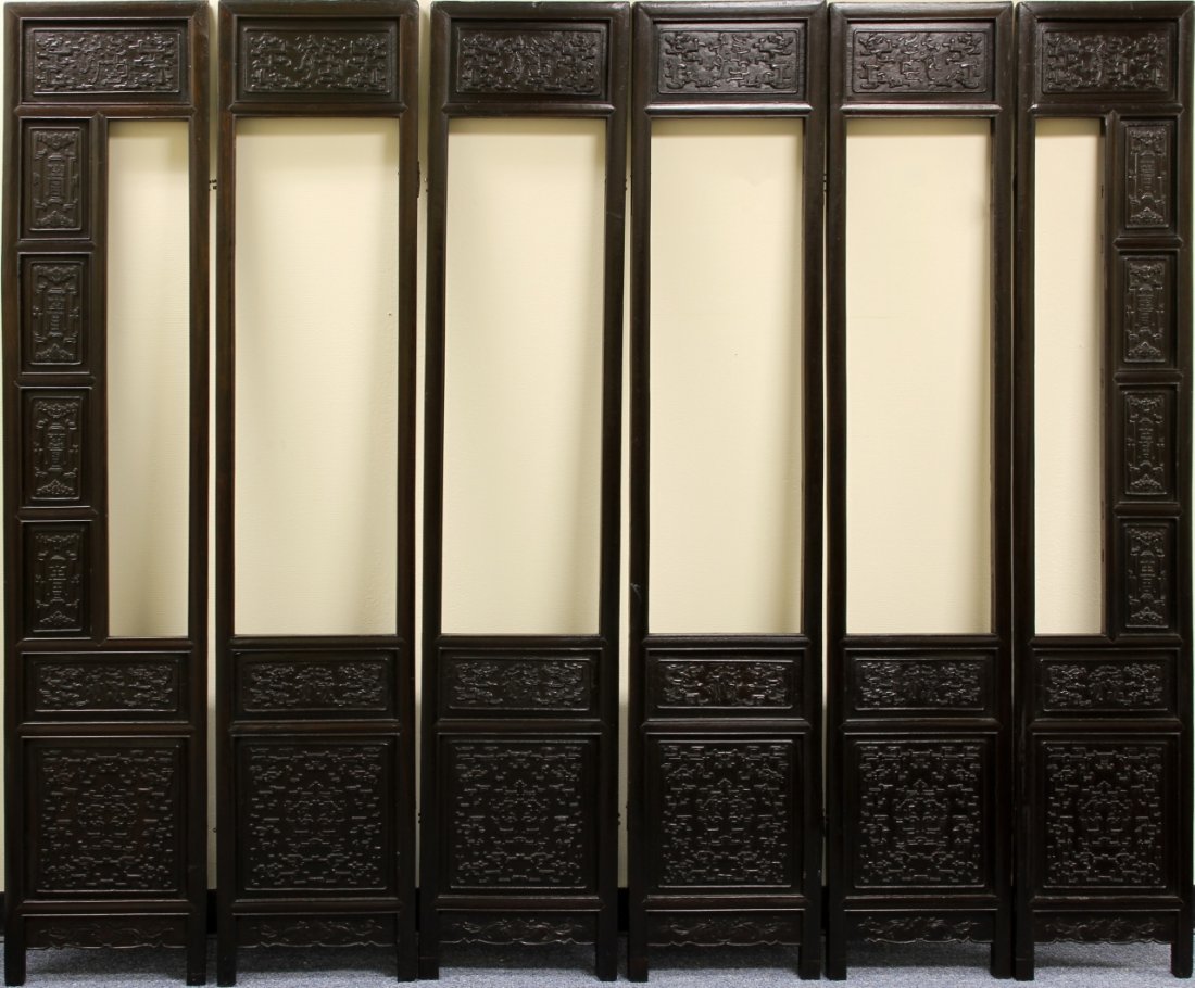 Six Chinese Zitan Screen Panels: China, 18th C., Qianlong Period, six very rare and important Zitan wood screen panels with both sides carved in relief, with "Hundred Treasure" motifs. Width of each, 14 1/4 in., Height 70 1/2 in.