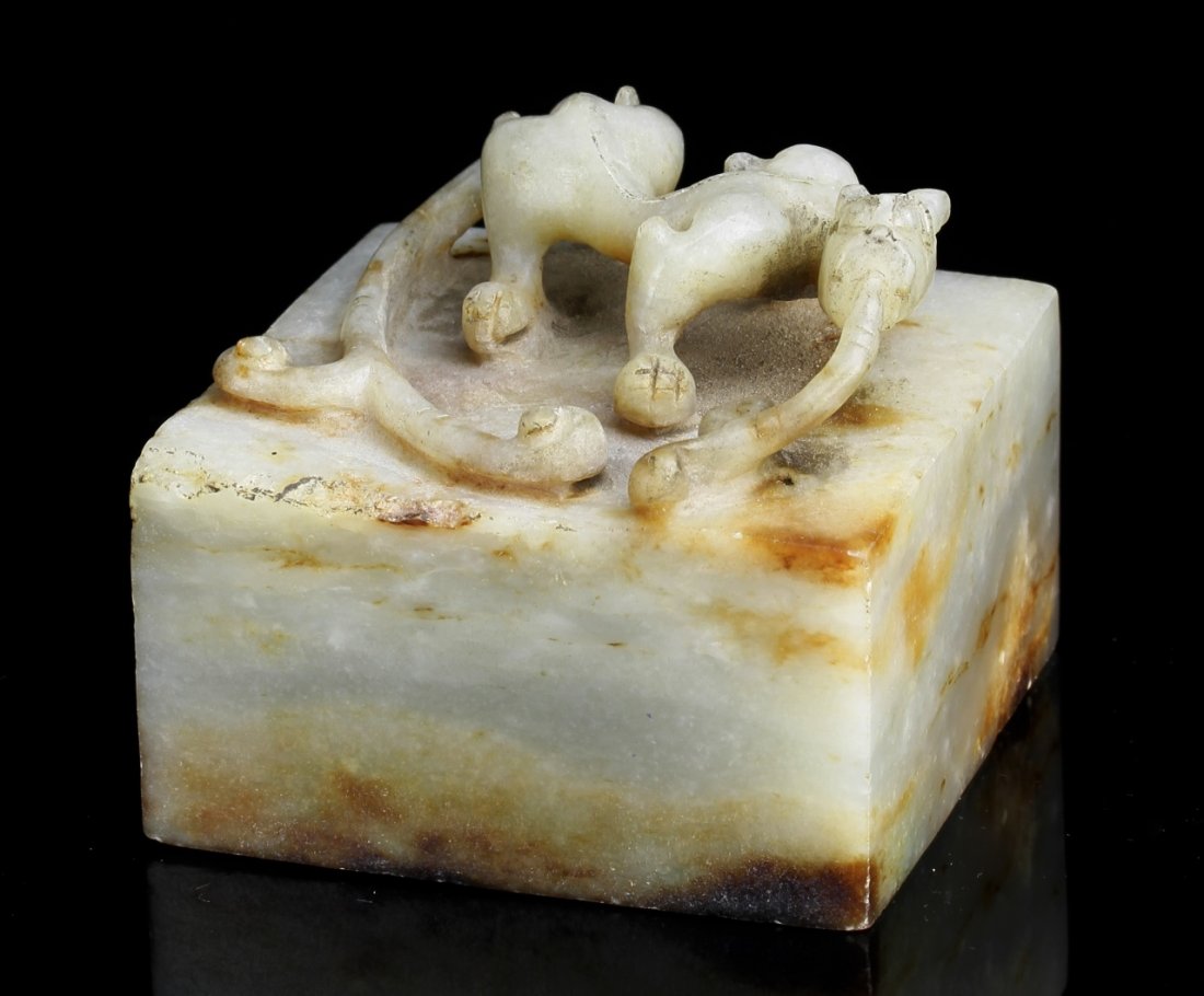 Chinese Jade Seal: China, jade seal, unique, natural colored jade throughout, with straight carved lines, mythical creature finial standing on the top. Width: 2 1/2 in., Height: 2 in., Length: 2 1/2 in.